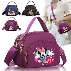 Super Cute Mickey and Minnie Purse/Crossbody. Purse is the Purple Color